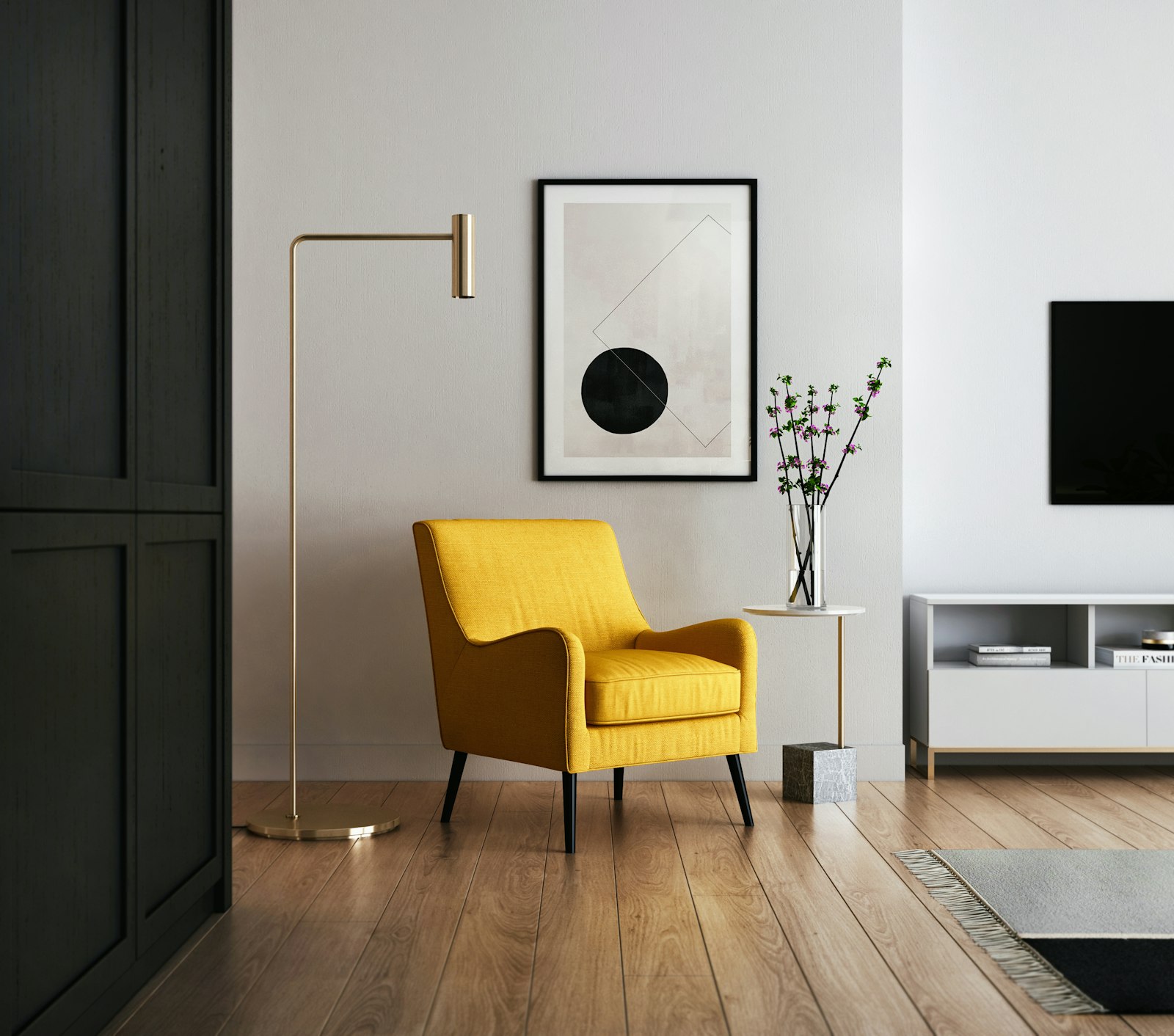 Minimal sitting room with a mustard armchair and a framed print